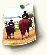  A pony and rider next to a horse and rider at a hunter/jumper show