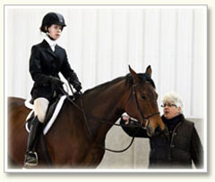 Sara Timmis instructing Jenny Salinger before she enters the arena